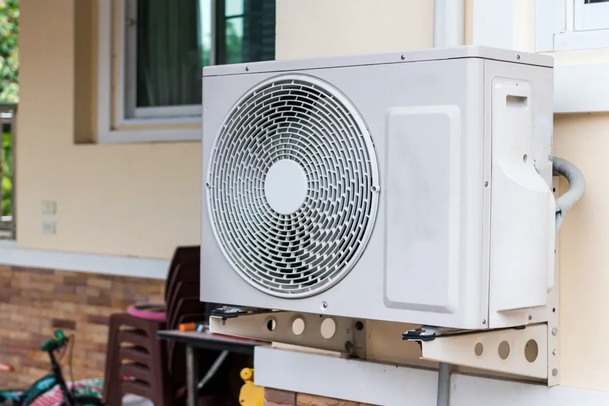 Outdoor heat pump unit on a wall bracket
